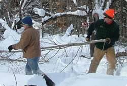 men work the woods in snow