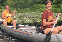  two women in a canoe