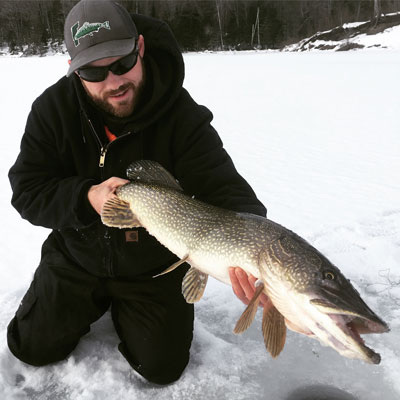 angler with large Northern Pike