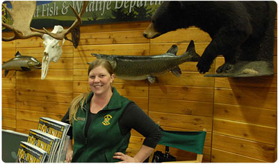 outreach staff at a display booth