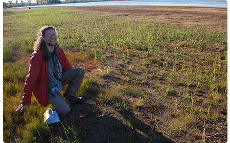 Aaron Marcus showing rare grasses of Lake Champlain
