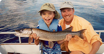 father and son with pike