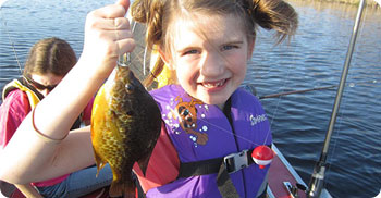 young girl with panfish