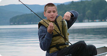 boy fishng in a canoe 
