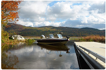 boating on pond with fall colors