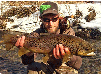 angler with a nice brown trout