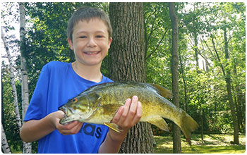 Young angler with a bass