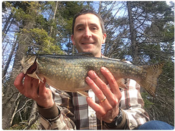 Anlger with a nice brook trout