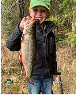 young anlger with nice brook trout