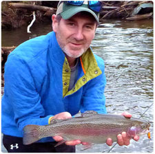 Shawn Good with a rainbow trout