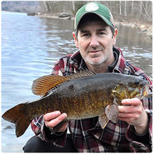 Shawn Good with a smallmouth bass