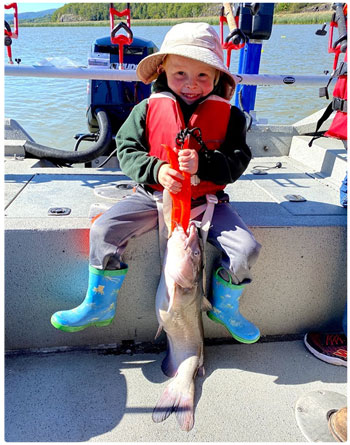 young angler with a catfish