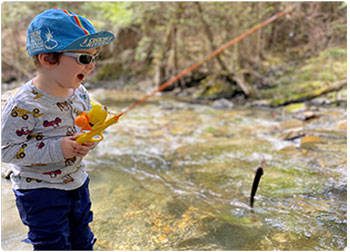 young angler with his first brook trout
