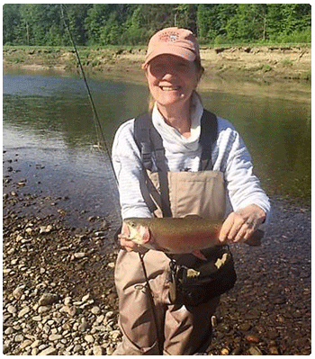 women angler with a nice rainbow trout