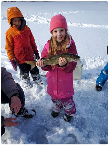 Excited and happy young ice anglers