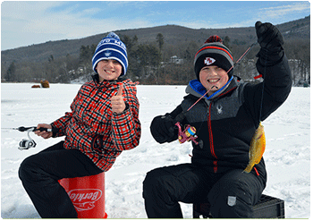 Two young anglers enjoying a day on the ice