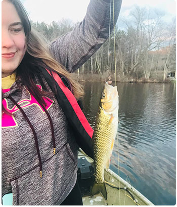 women angler with a fallfish