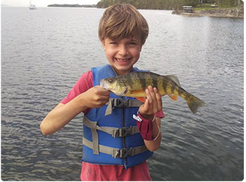 young angler with a yellow perch