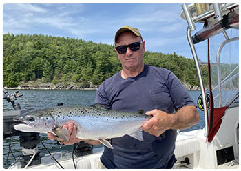 Angler with a nice Lake Champlain salmon