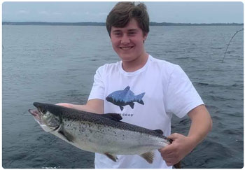 Young angler with nice salmon