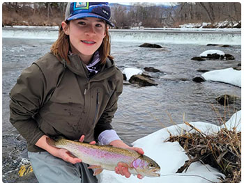 young angler with rainbow trout