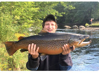 angler with a trophy brown trout