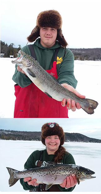 two anglers with nice salmon caught through the ice