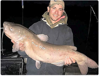 angler with a catfish