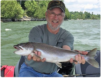 Brain Ames with lake trout from Lake Champlain