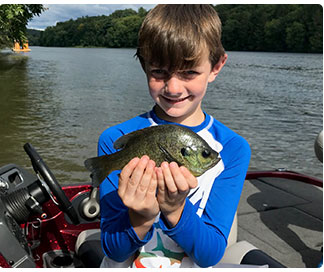 young angler with a bluegill