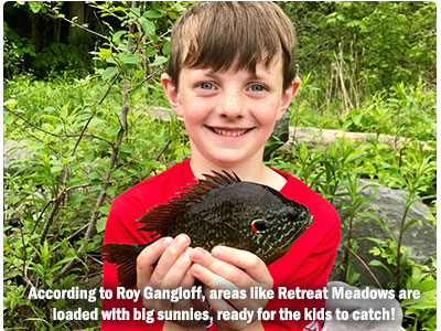 young boy with nice pumpkinseed sunfish