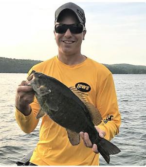 young man with smallmouth bass