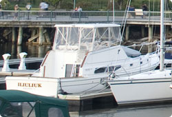 two large boats tied up at a marina