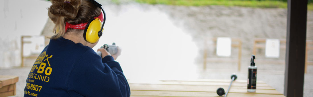 girl shooting at targets at a shooting range