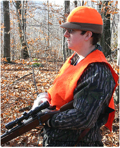 novice hunter on stand in the woods
