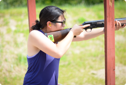 Young woman at a shooting station