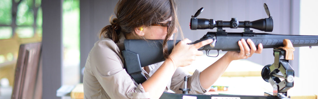 woman taking aim