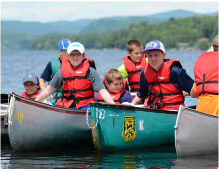 boys in canoes at GMCC camp