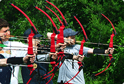 group of boys aiming bows