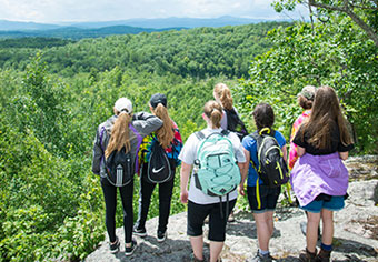 girls viewing mountains from overlook