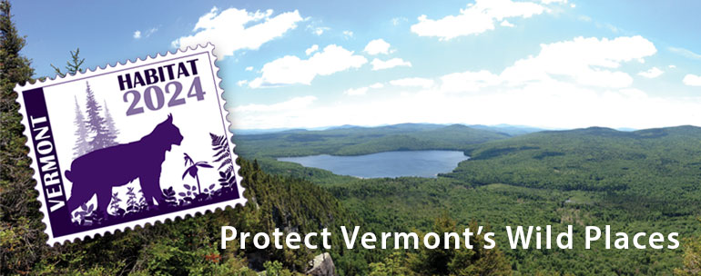 view of mountains and lake with habitat stamp overlay