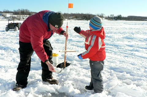 father and son ice fishing